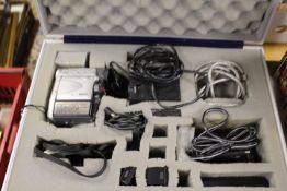 A HARD CASE CONTAINING A CANNON MV20 PAL DIGITAL VIDEO CAMCORDER AND ACCESSORIES