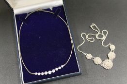 TWO SILVER NECKLACES