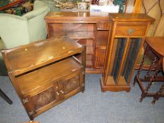 AN OAK GLAZED BOOKCASE, TROLLEY AND CD TOWER (3)