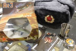 A SELECTION OF ASSORTED MILITARY THEMED ITEMS TO INCLUDE VARIOUS RUSSIAN ? ITEMS SUCH AS A SOVIET