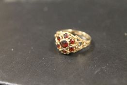 A HALLMARKED 9 CART GOLD GARNET SET DRESS RING APPROX 2.6G