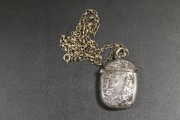 AN ANTIQUE SILVER VESTA CASE ON SILVER CHAIN