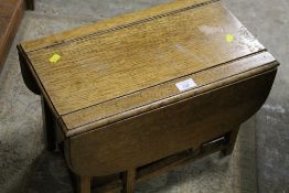 A MINIATURE OAK GATE LEG KITCHEN TABLE