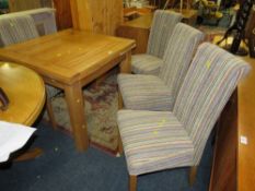 A MODERN OAK FURNITURE LAND DRAWLEAF TABLE AND FOUR CHAIRS
