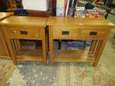 A MODERN LIGHT OAK TWO DRAWER CONSOLE TABLE TOGETHER WITH A SINGLE DRAWER LAMP TABLE (2)