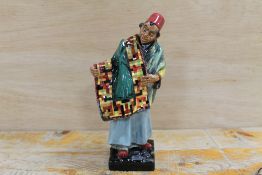 A ROYAL DOULTON FIGURINE 'CARPET SELLER' HN1454