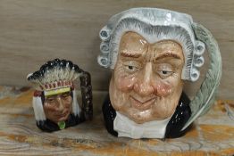 A ROYAL DOULTON CHARACTER JUG 'THE LAWYER'. TOGETHER WITH A SMALL NORTH AMERICAN INDIAN EXAMPLE (2)