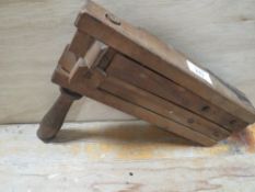 A VINTAGE WOODEN A.R.P HAND RATTLE BY B & E LIMITED DATED 1941