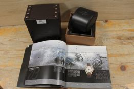 A BREITLING WATCH BOX TOGETHER WITH AN ASSOCIATED CATALOGUE