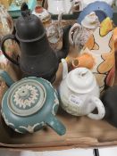 A SMALL TRAY OF ASSORTED TEA POTS TO INCLUDE A BLACK BASALT STYLE EXAMPLE