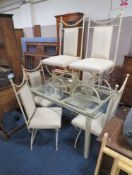 A MODERN GLASS AND METAL DINING TABLE AND SIX CHAIRS
