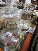 A UNUSUAL BRASS STYLE OIL LAMP TOGETHER WITH A SILVER PLATED DECANTER AND STAND