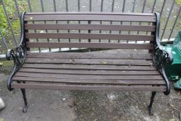 A CAST / WOODEN GARDEN BENCH