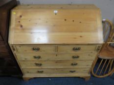 AN ANTIQUE PINE COUNTRYMADE BUREAU - W 106.5 cm