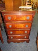 A REPRODUCTION MAHOGANY FOUR DRAWER CHEST