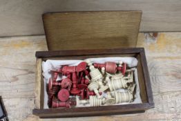 AN ANTIQUE BONE CHESS SET IN BOX - A/F