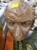 A CLAY MODEL OF A GENTLEMANS HEAD