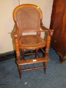 A CHILDS ANTIQUE BERGERE HIGH CHAIR