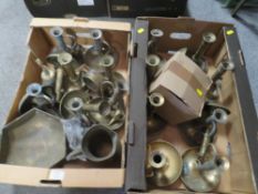 TWO TRAYS OF BRASS CHAMBER STICK TYPE CANDLESTICKS