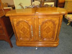 A MODERN SIDE CABINET WITH SLIDING TOP