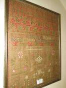 A FRAME AND GLAZED 19TH CENTURY SAMPLER - CATHERINE OWEN 1825