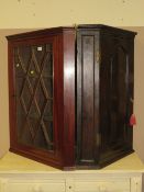A 19TH CENTURY MAHOGANY GLAZED HANGING CORNER CABINET (2)