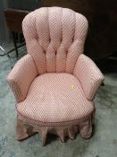 A VINTAGE UPHOLSTERED SMALL ARMCHAIR