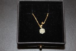 A HALLMARKED 9CT GOLD DIAMOND CLUSTER PENDANT