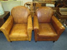 A PAIR OF MODERN TAN LEATHER CLUB STYLE ARMCHAIRS - NOTE: COLOURS ARE DIFFERENT