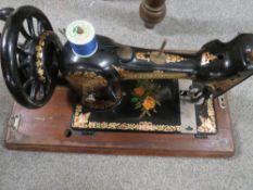 A VINTAGE CASED CS JONES SEWING MACHINE