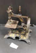 A MINIATURE GERMAN SEWING MACHINE