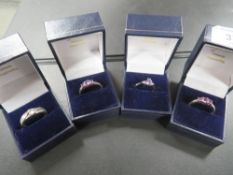 FOUR GEMSET SILVER RINGS