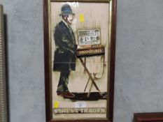 A FRAMED TWO TILED PICTURE ENTITLED STREET TRADER