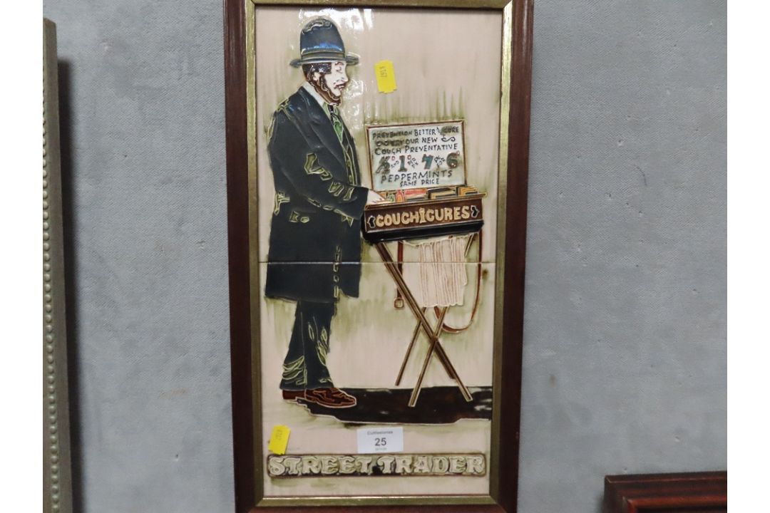A FRAMED TWO TILED PICTURE ENTITLED STREET TRADER