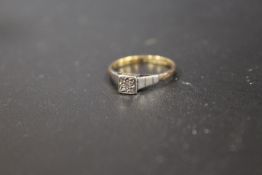 AN 18CT AND PLAT ILLUSION SET DIAMOND RING
