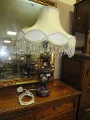 A LARGE DECORATIVE CHINA TABLE LAMP AND SHADE