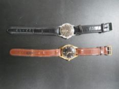 A MILITARY STYLE BLACK DIALED WATER PROTECTED ANTI MAGNETIC STOSSGESICHERT 16 RUBY WRISTWATCH -