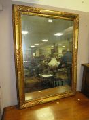 A LARGE GILT RECTANGULAR MIRROR - 106 x 79 cm