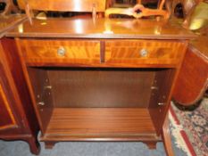A REPRODUCTION MAHOGANY OPEN SMALL BOOKCASE