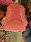A VICTORIAN UPHOLSTERED ARMCHAIR