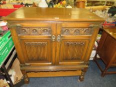 AN OAK LINENFOLD TWO DRAWER CABINET - W 90 cm