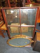 A WINDOW FRAME MIRROR AND AN OVAL GILT MIRROR (2)