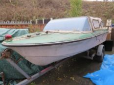 A FIBREGLASS LEISURE BOAT