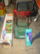 A POWERED QUALCAST SCARIFIER / RAKE TOGETHER WITH A BOXED FLYMO STRIMMER ETC