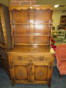 AN OAK CARVED SMALL WELSH STYLE DRESSER
