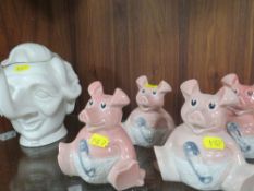 A NOVELTY TEAPOT IN THE FORM OF MARGARET THATCHER TOGETHER WITH FOUR NAT WEST PIGGY BANKS
