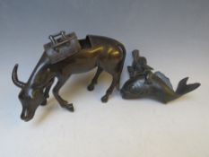 A BRONZE ORIENTAL CENSOR, modelled as an ox with removable saddle, L 22 cm, together with a Buddha
