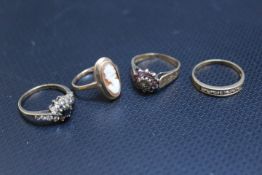 FOUR HALLMARKED 9 CARAT GOLD DRESS RINGS, set with CZ's etc., to include a cameo example, approx