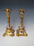 A PAIR OF ROYAL CROWN DERBY OLD IMARI PATTERN CANDLESTICKS - ONE CANDLESTICK A/F, pattern no.