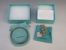 A 1997 TIFFANY & Co. 925 SILVER BANGLE, together with a hallmarked silver chain link style
